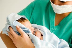 Midwife carrying out maternity services