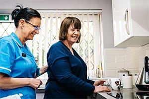 care worker and service user manage staffing levels